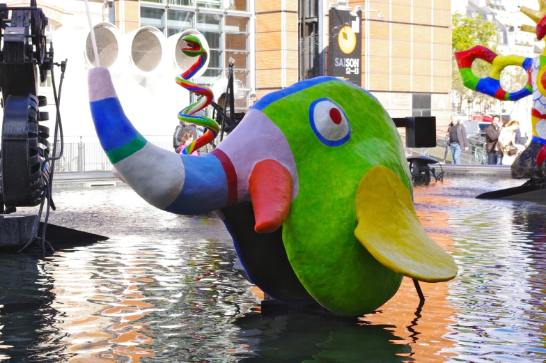 large colorful elephant float floats in the water