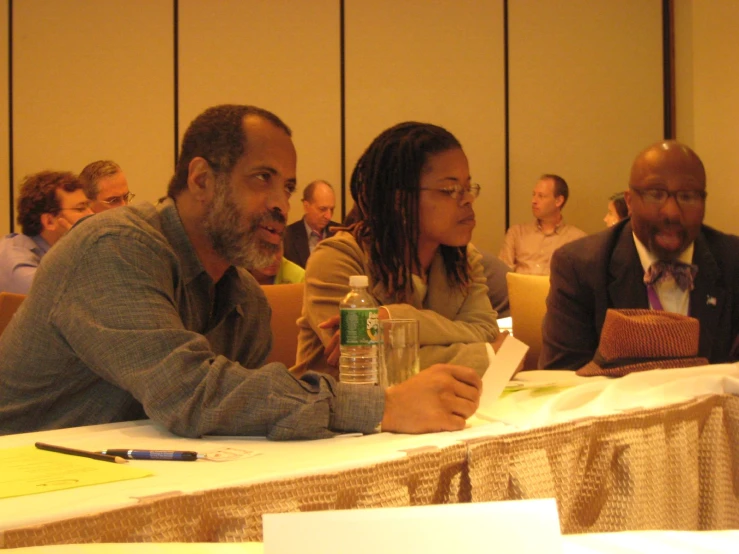 several people sitting in front of a table