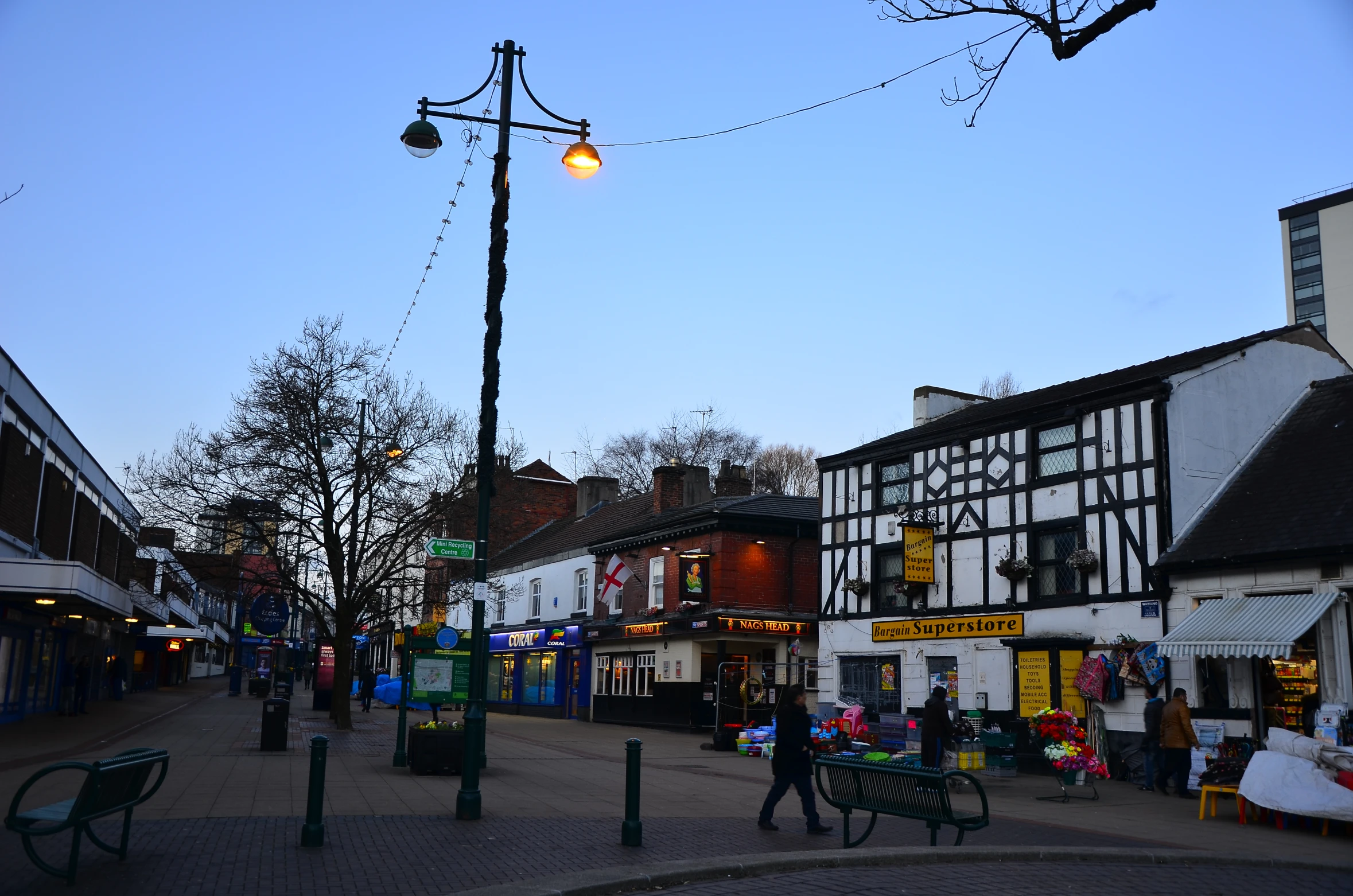 the light post is suspended over the city street