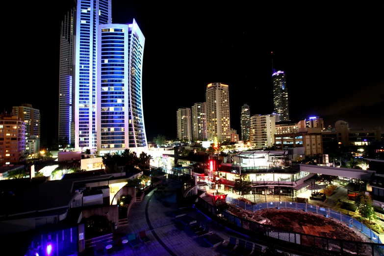 a city with a lot of tall buildings and a clock tower