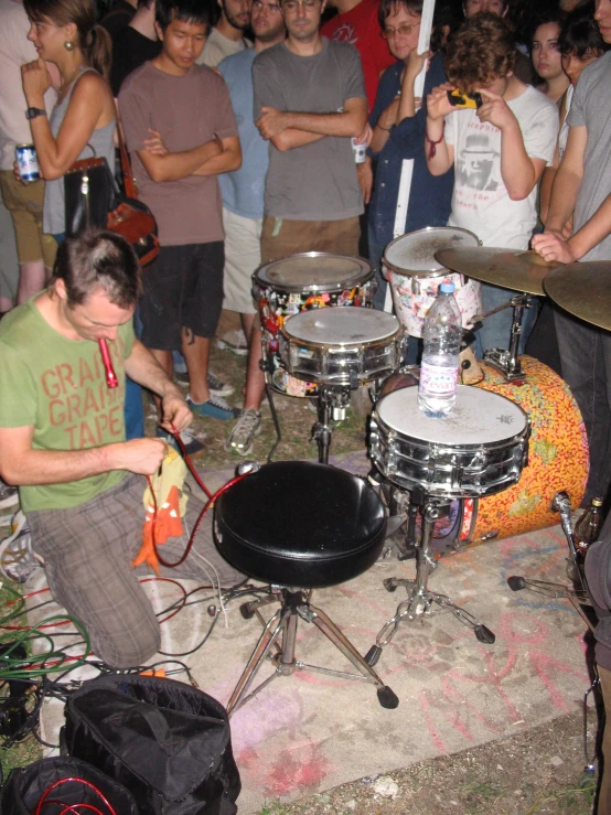 a drummer playing the drums at a rock concert