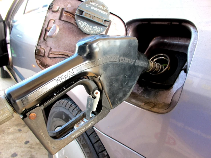 a gas pump is sitting in the front of a car