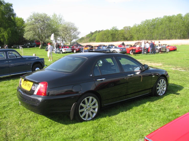 there is a car that is parked in the grass