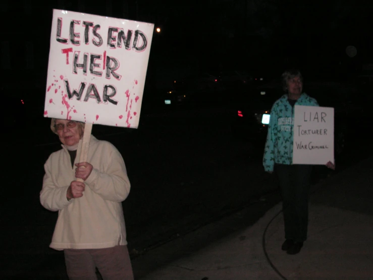 people in street protesting for war and climate change