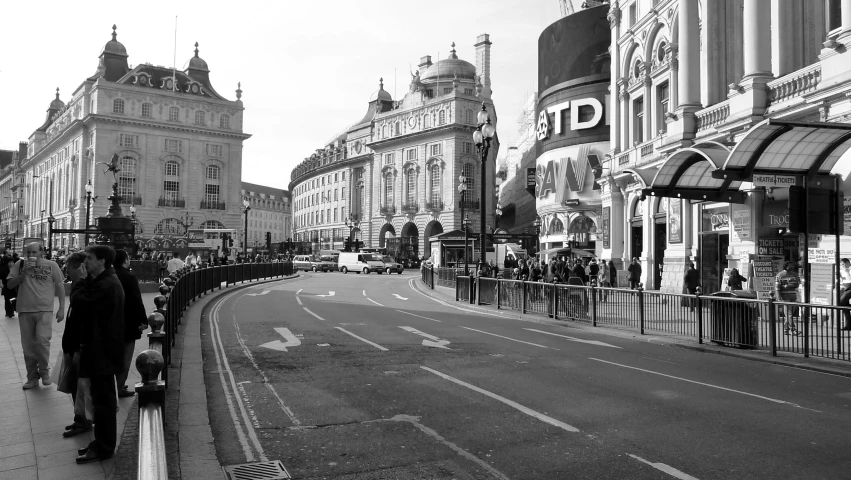 this is a city street that has people walking down it