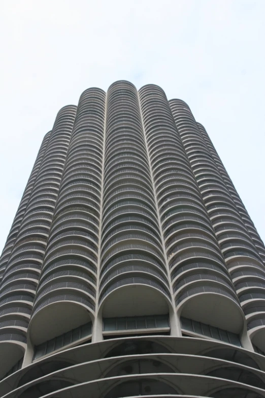 an image of some tall buildings taken from below