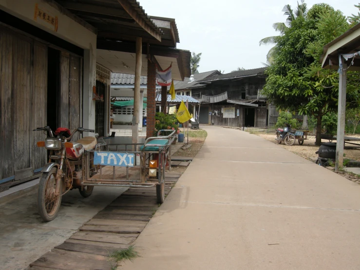 two bikes parked along the street of a small village