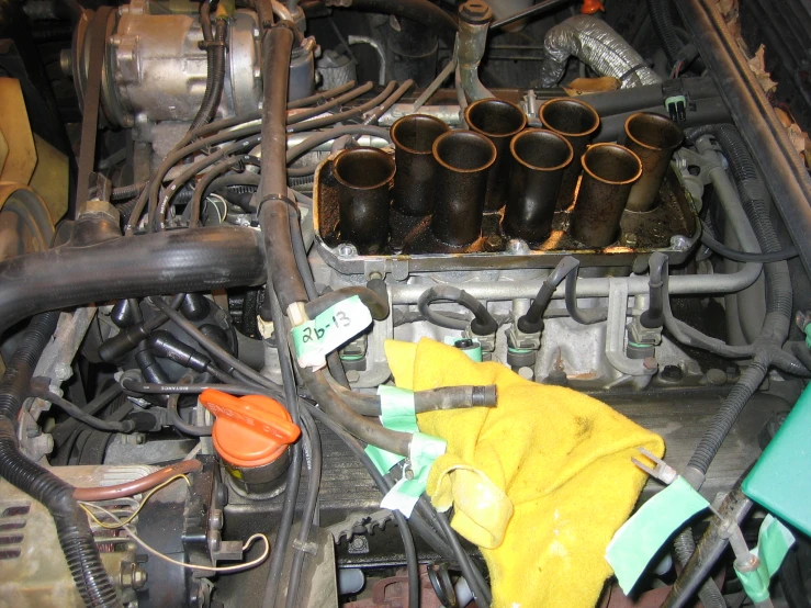 a vehicle engine with several cleaning products