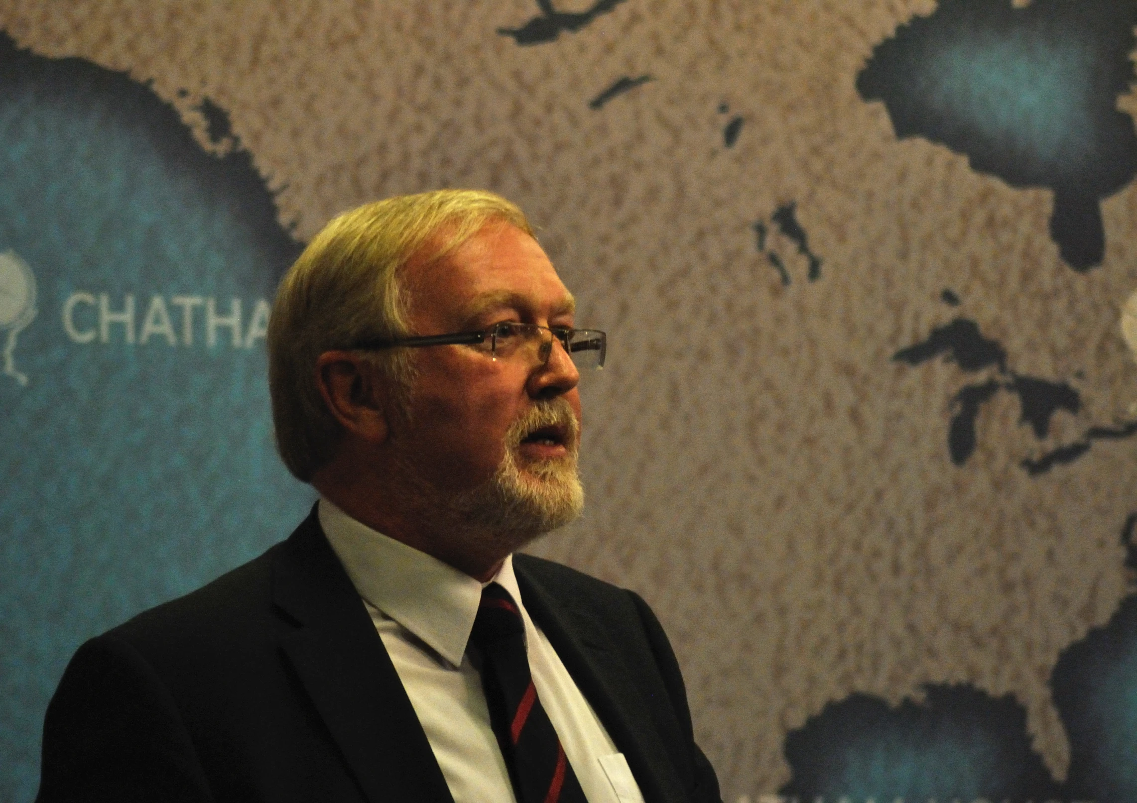 a man is standing in front of a projection map