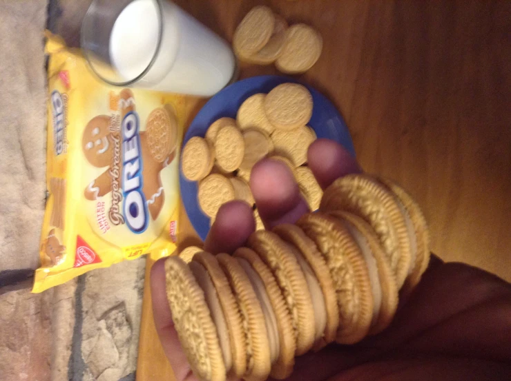 a person holding a cookie and peanut er snack