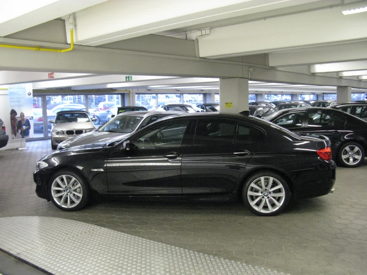 an empty parking lot with a bunch of parked cars