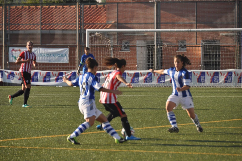 some children are playing soccer on a field