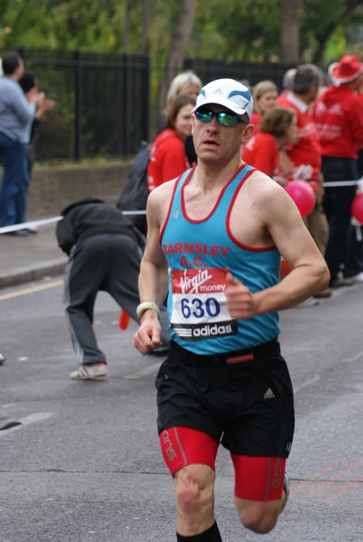 a person running in the street near other people