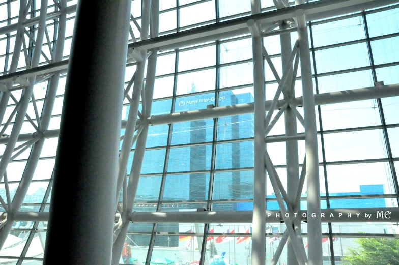 a tall building seen through a glass window