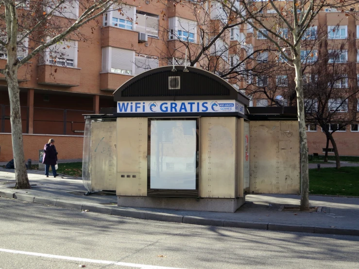 a couple of toilet stalls sitting in the side of a street