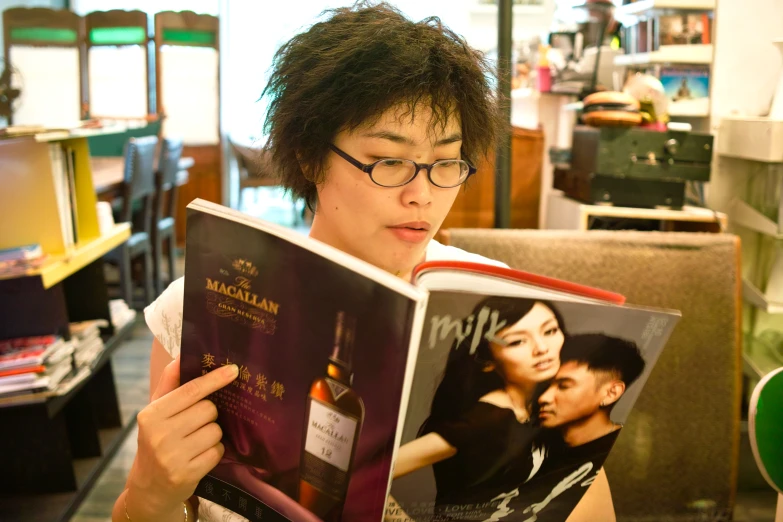 a man reading a book about the life of a winemaker