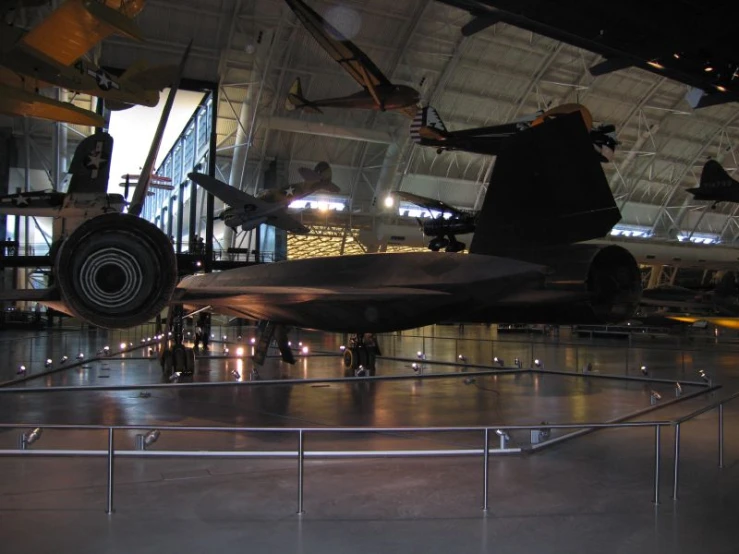 an old military aircraft parked in an airfield