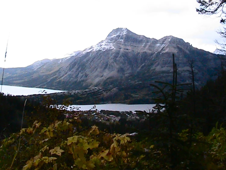 there are two people on this path looking at the mountain