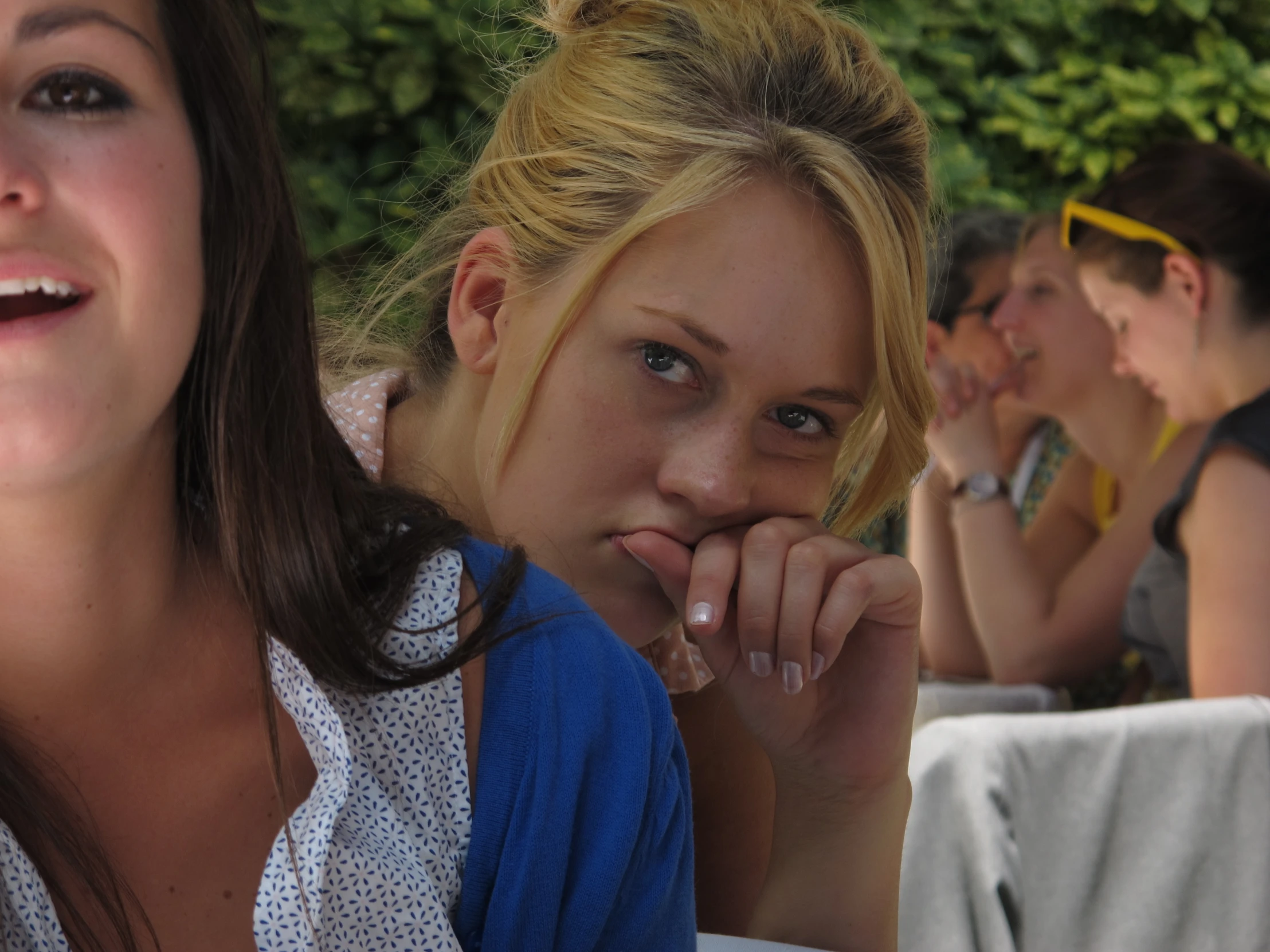 two girls who are both looking away from the camera