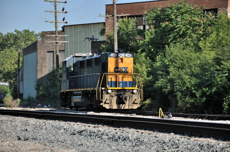 a train traveling on train tracks next to a building