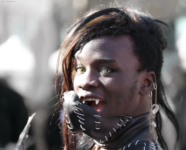 an african american woman has green eyes and black hair