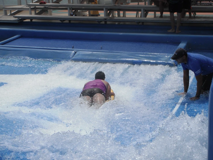 children playing at an artificial water park
