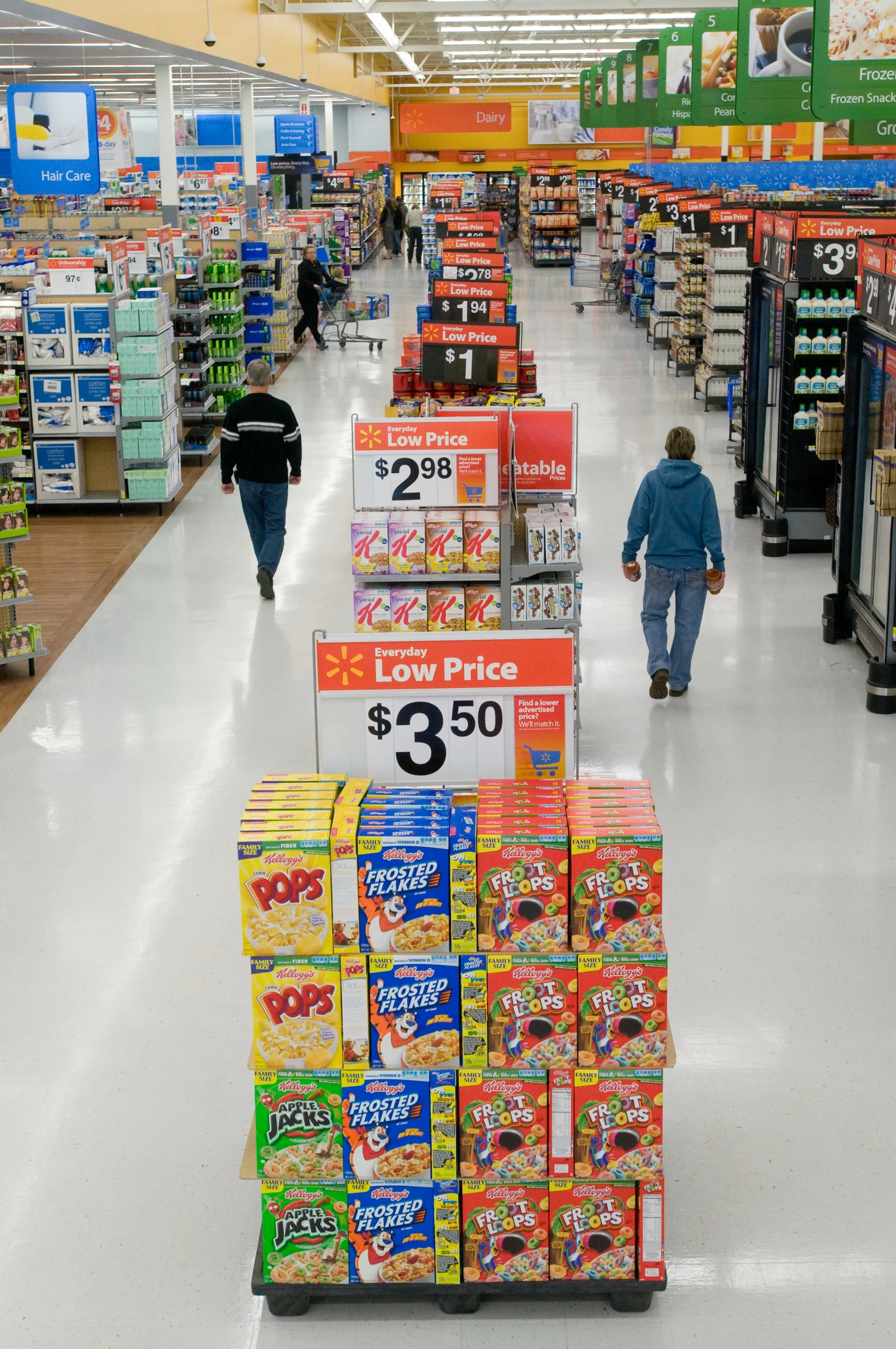 a child walks down the aisle of a grocery store