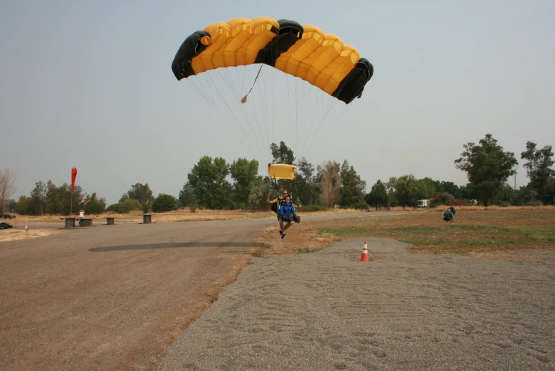 people are flying huge yellow balloons high into the air