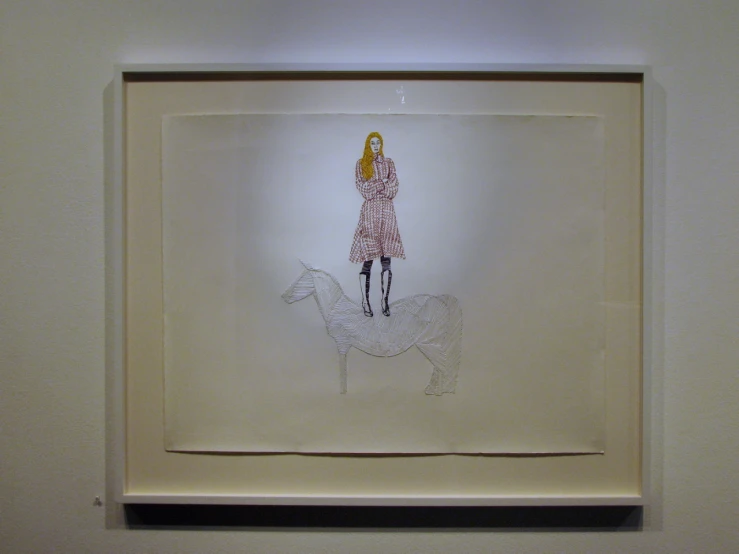 a drawing in a display case of a girl and dog