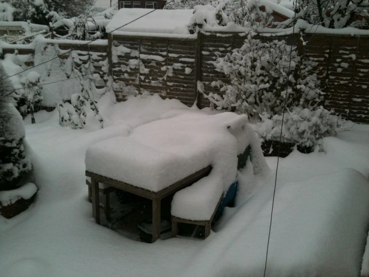 a snow covered building sits in the middle of snow