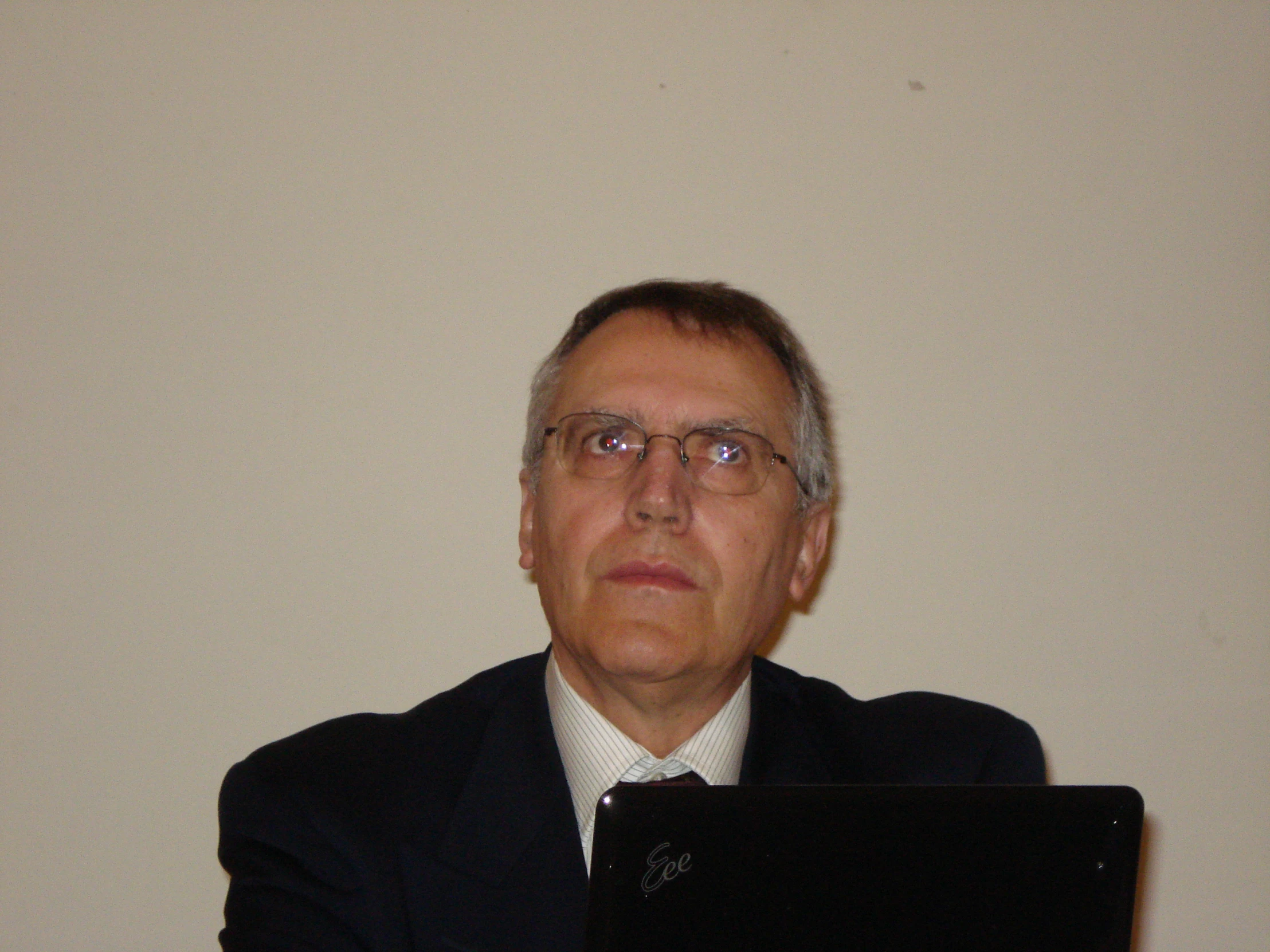 a man sitting in front of a laptop computer