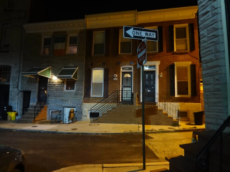 the building on the corner has two streets signs posted at their corners