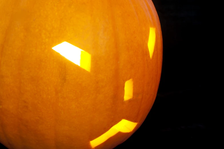 a close up of an orange pumpkin on the table