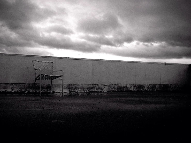 a white billboard in the middle of an empty road