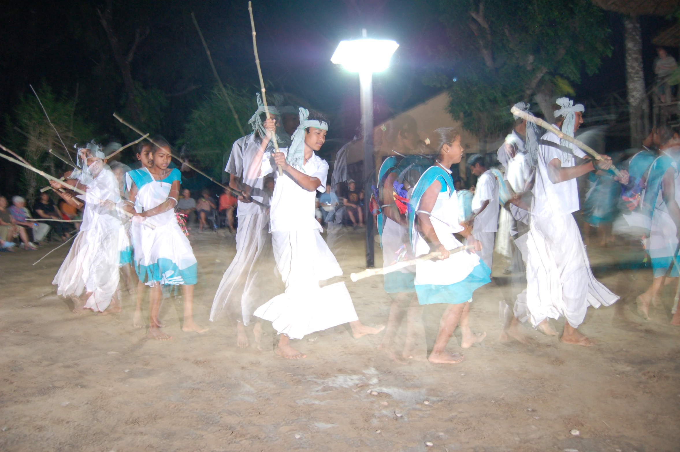 an image of people with spears in the desert