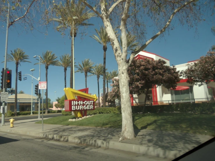 a mcdonalds restaurant sign is shown near a street