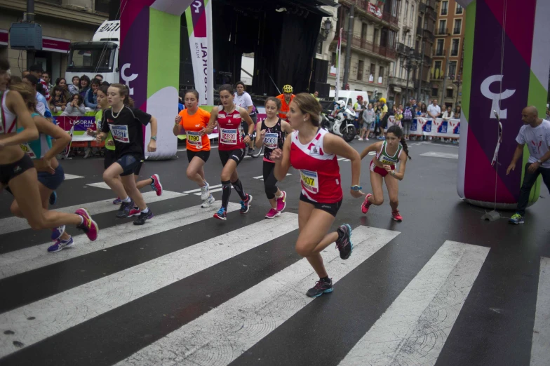 a marathon with many people running down a street