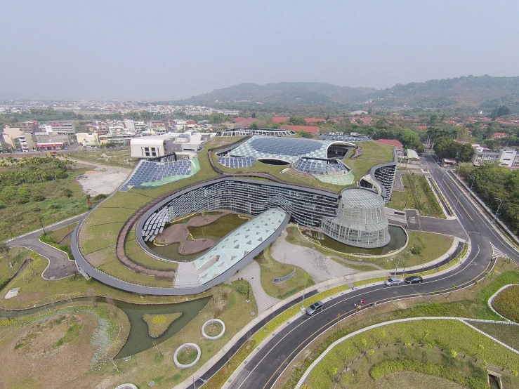 a bird's eye view of a building in the middle of a street