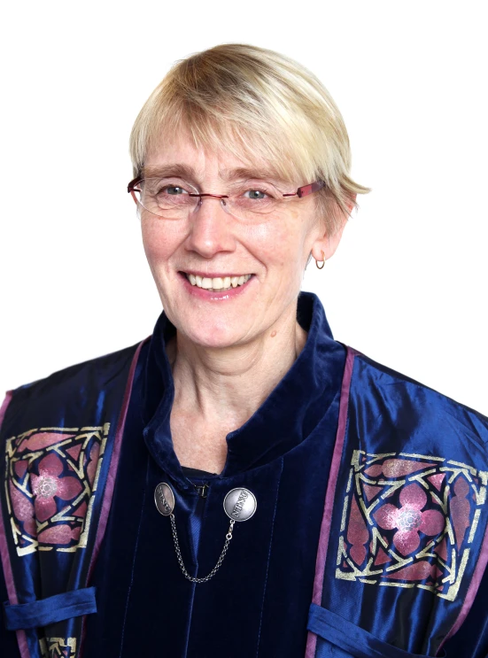 a lady in a blue coat with badges on it