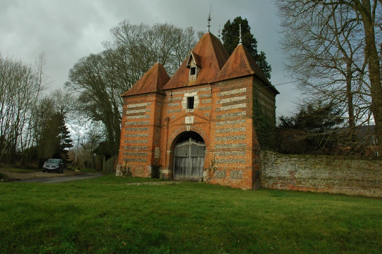 this old brick building has two windows and a clock tower