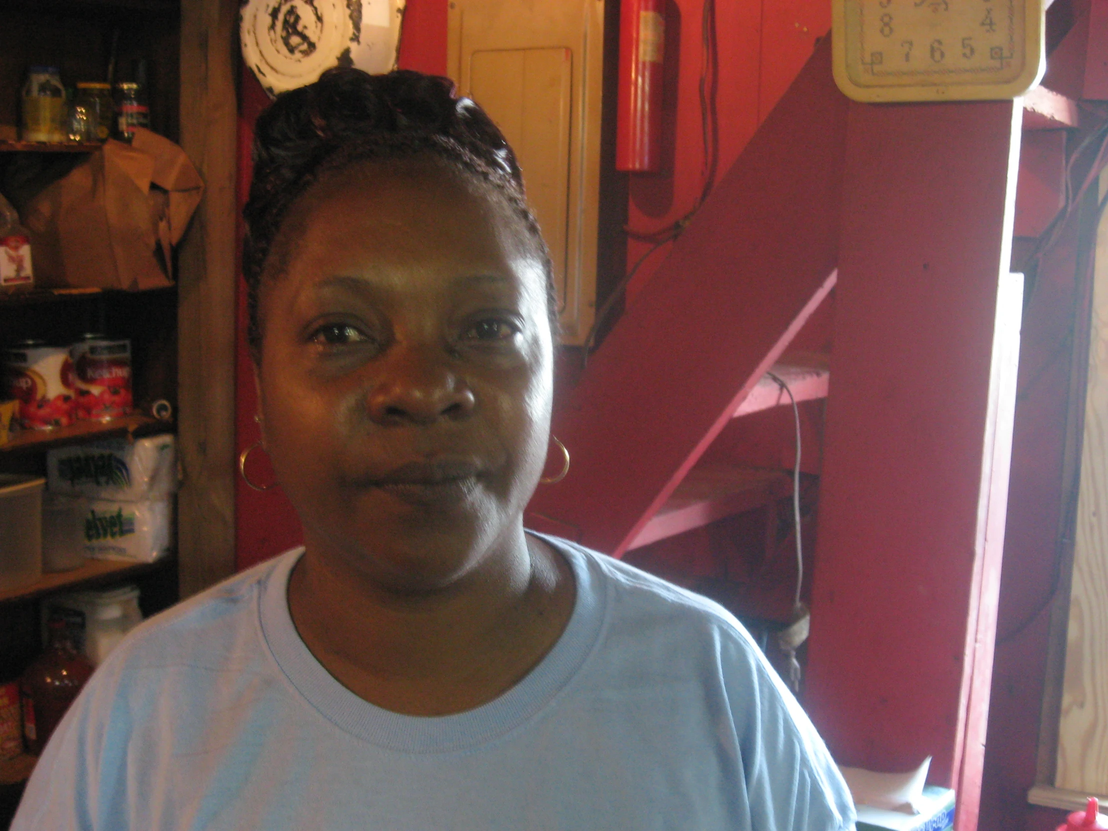 an image of a woman standing in front of red wall