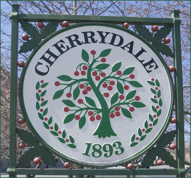 a sign advertising a store and an apple tree with leaves