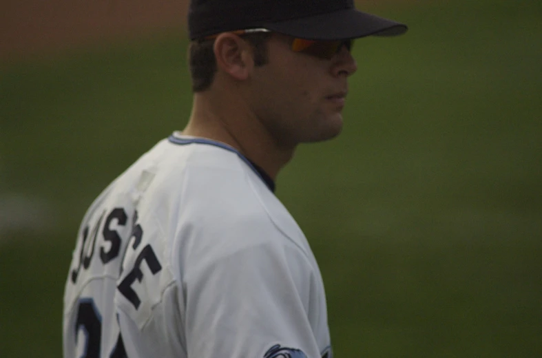 a close up of a baseball player with his hat on