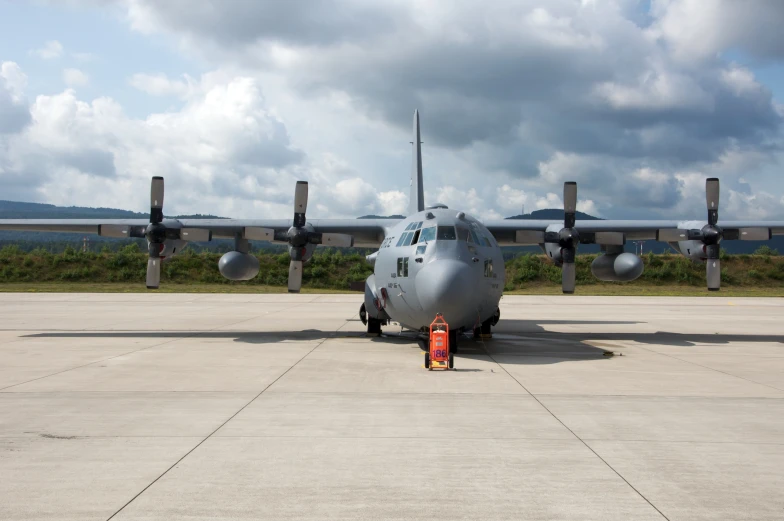 an airplane is parked in front of some planes