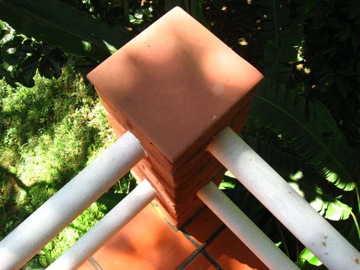 there is a small wooden box on a tile deck