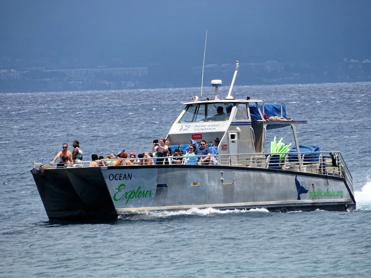 a boat that is on some water with people sitting in it