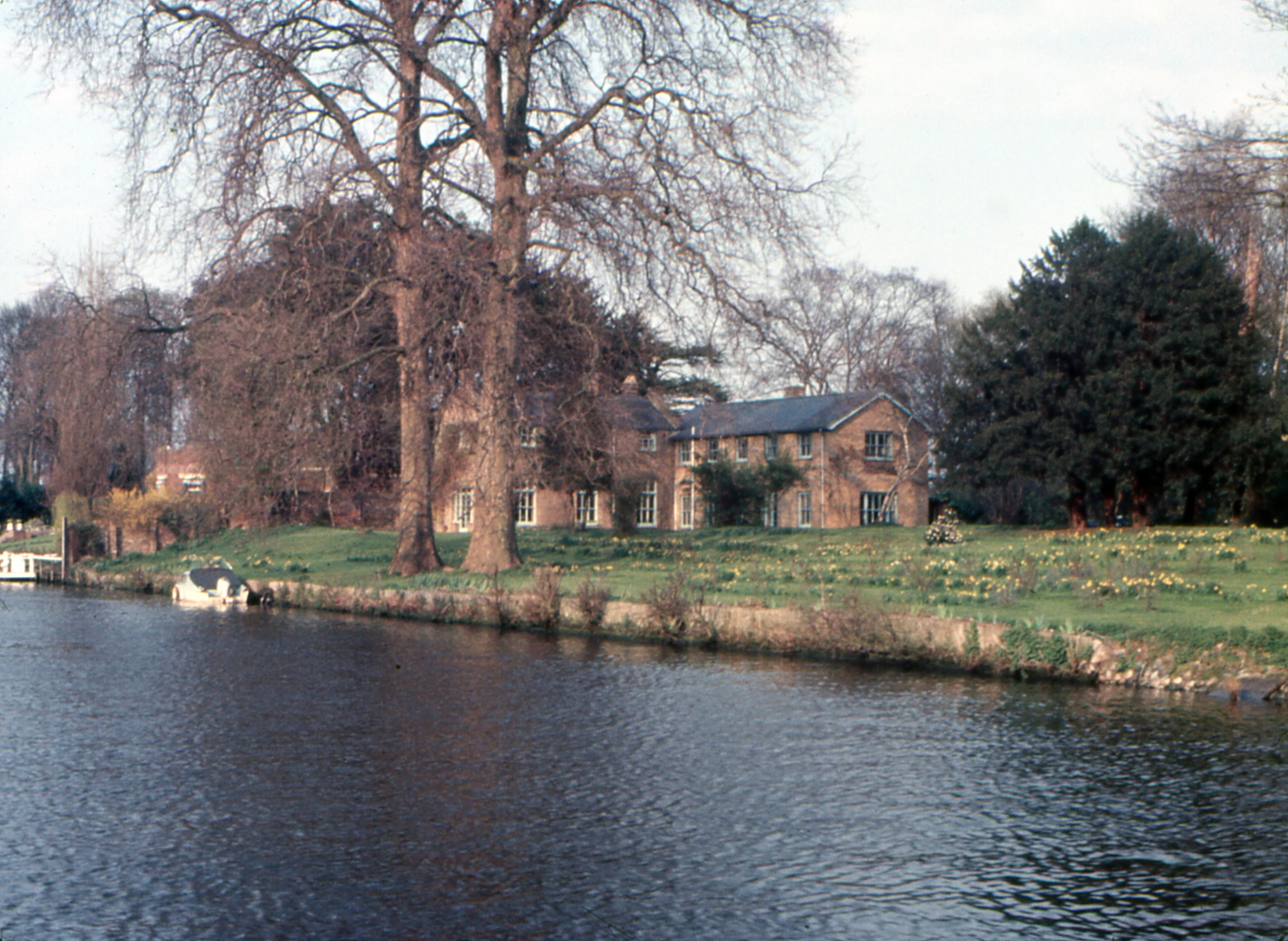 the house is near a lake in front of it