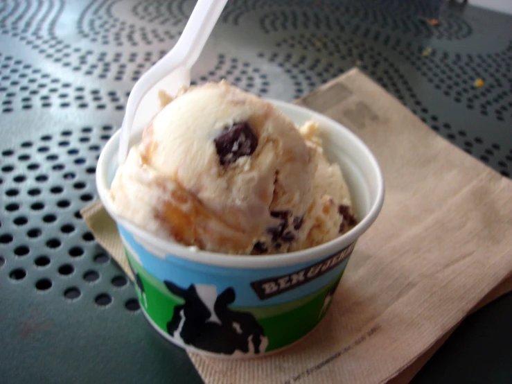 an ice cream dessert with chocolate chips in a cup