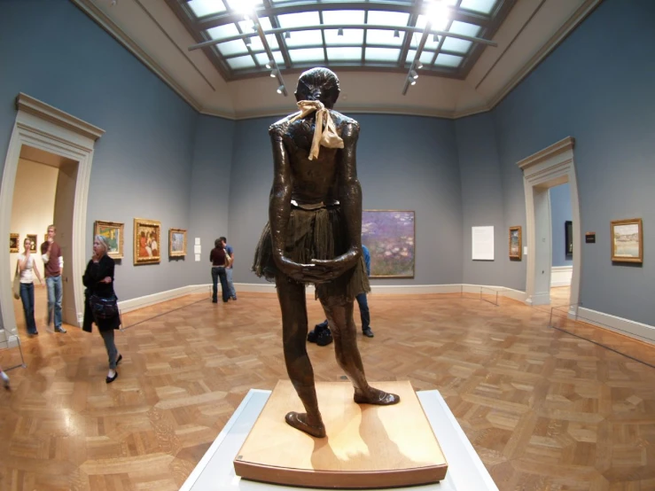 a statue that is standing up in a room