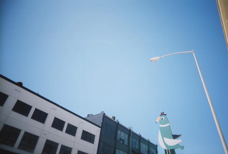 a view of a street light on the corner of a street